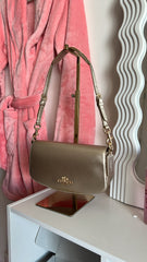 Bolso de hombro Coach Dorado