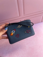 Wristlet Coach sencilla con estampado